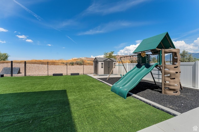 3032 W Cramden Dr, Lehi, UT 84043 - view of playground with a lawn, fence, an outdoor structure, and a shed