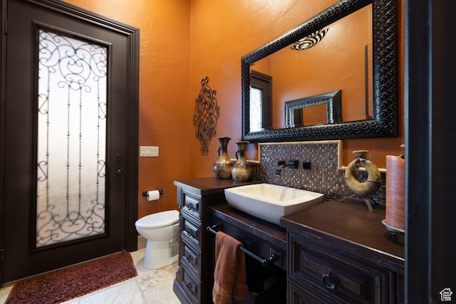 4757 Hidden Lake Dr, Bountiful, UT 84010 - bathroom with toilet, vanity, and decorative backsplash