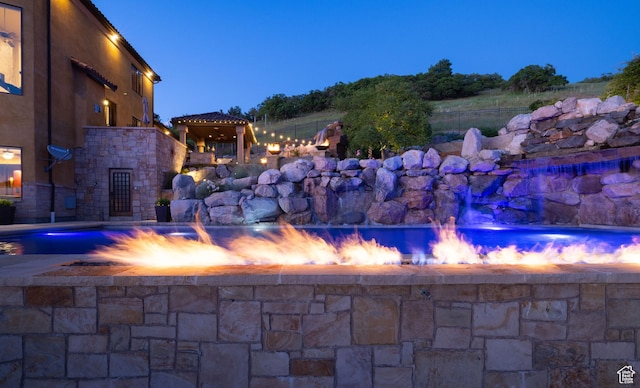 4757 Hidden Lake Dr, Bountiful, UT 84010 - exterior space with fence, stone siding, and a pool