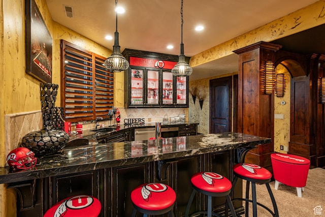 4757 Hidden Lake Dr, Bountiful, UT 84010 - bar with a sink, bar area, stainless steel dishwasher, decorative light fixtures, and carpet