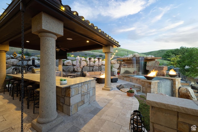 4757 Hidden Lake Dr, Bountiful, UT 84010 - view of patio / terrace with fence, a fire pit, outdoor dry bar, and ceiling fan