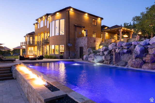 4757 Hidden Lake Dr, Bountiful, UT 84010 - outdoor pool featuring an outdoor fire pit, stairway, and a patio area