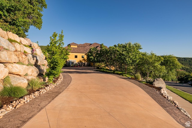4757 Hidden Lake Dr, Bountiful, UT 84010 - view of front of property featuring a tile roof, curved driveway, and stucco siding