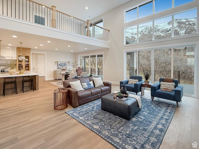 4014 N Dillon Way N, Ogden, UT 84414 - living room with baseboards, light wood-type flooring, and a healthy amount of sunlight