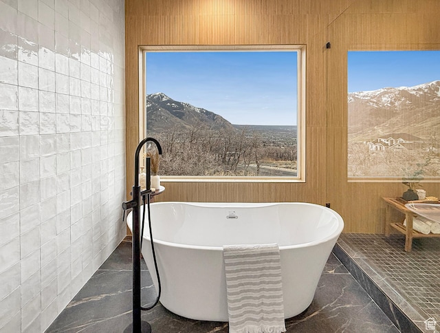 4014 N Dillon Way N, Ogden, UT 84414 - bathroom with marble finish floor, a freestanding tub, and a mountain view