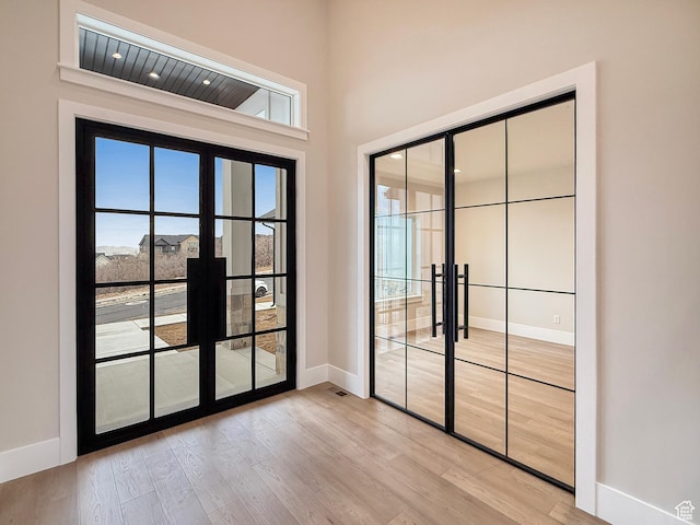 4014 N Dillon Way N, Ogden, UT 84414 - empty room with light wood finished floors, baseboards, and french doors