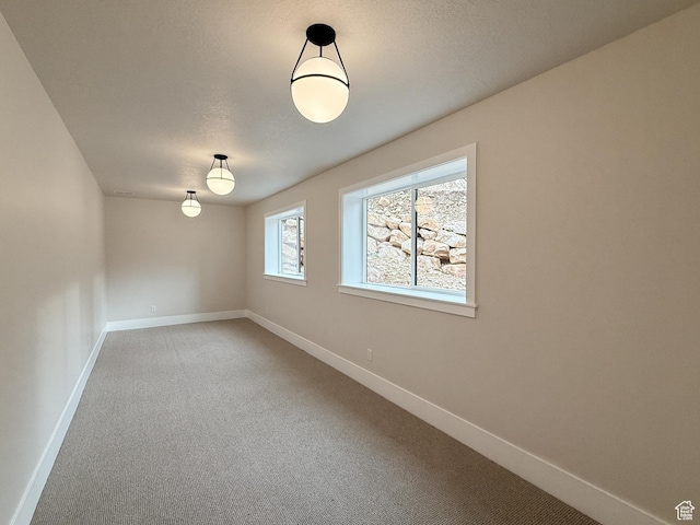 4014 N Dillon Way N, Ogden, UT 84414 - empty room with light carpet, baseboards, and a textured ceiling