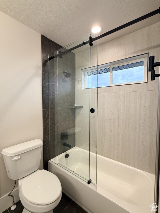 4014 N Dillon Way N, Ogden, UT 84414 - full bath with combined bath / shower with glass door, a textured ceiling, and toilet