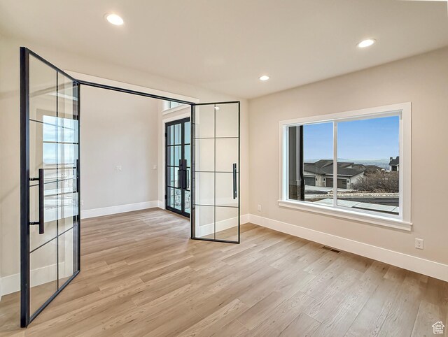 4014 N Dillon Way N, Ogden, UT 84414 - unfurnished room with french doors, recessed lighting, baseboards, and light wood-type flooring