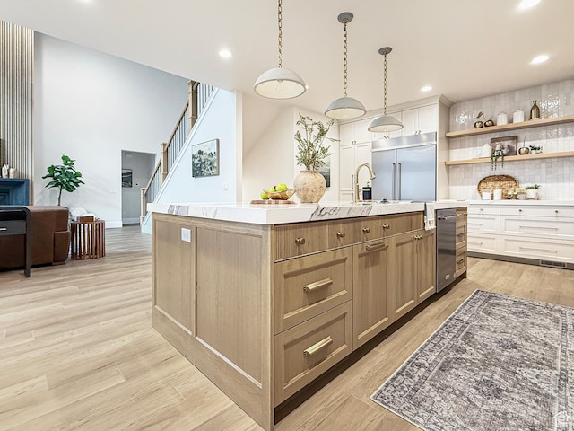 4014 N Dillon Way N, Ogden, UT 84414 - kitchen with light countertops, open shelves, light wood finished floors, stainless steel built in fridge, and white cabinets