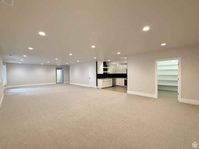 4014 N Dillon Way N, Ogden, UT 84414 - unfurnished living room featuring light colored carpet, baseboards, and recessed lighting