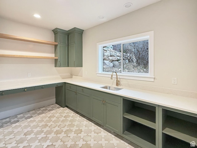4014 N Dillon Way N, Ogden, UT 84414 - kitchen with light countertops, a sink, open shelves, green cabinets, and built in desk
