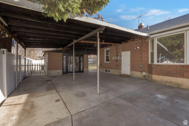view of patio with visible vents and fence