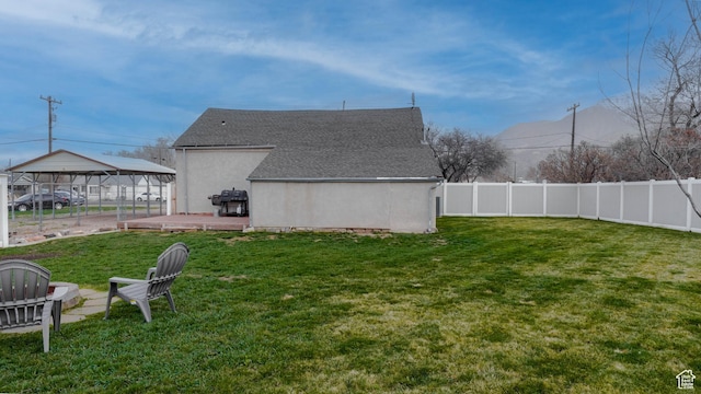view of yard featuring a fenced backyard and a wooden deck
