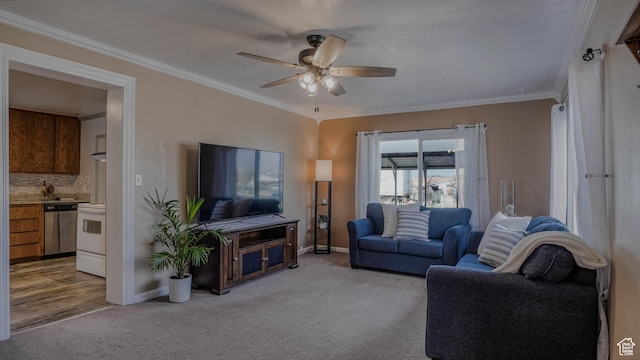 living area featuring ornamental molding, light carpet, baseboards, and ceiling fan
