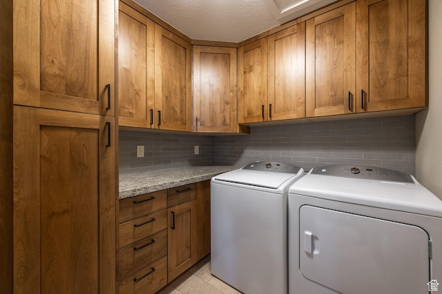 853 W Benjamin Pl, Kamas, UT 84036 - laundry room with light tile patterned floors, separate washer and dryer, cabinet space, and a textured ceiling