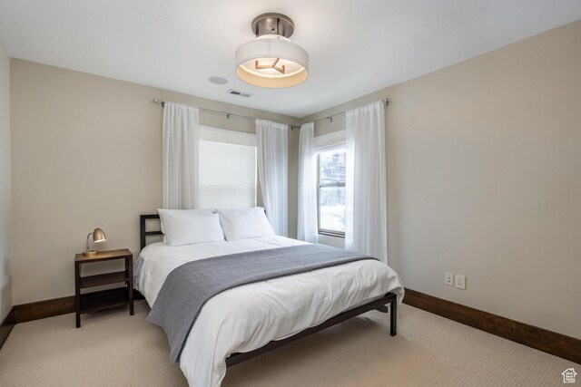 853 W Benjamin Pl, Kamas, UT 84036 - bedroom with baseboards, visible vents, and light carpet