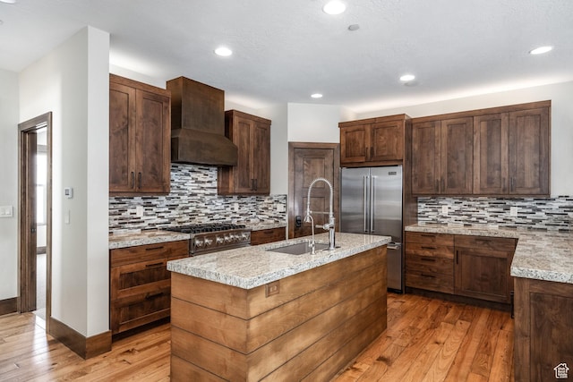 853 W Benjamin Pl, Kamas, UT 84036 - kitchen featuring tasteful backsplash, premium appliances, light wood-style flooring, and a sink