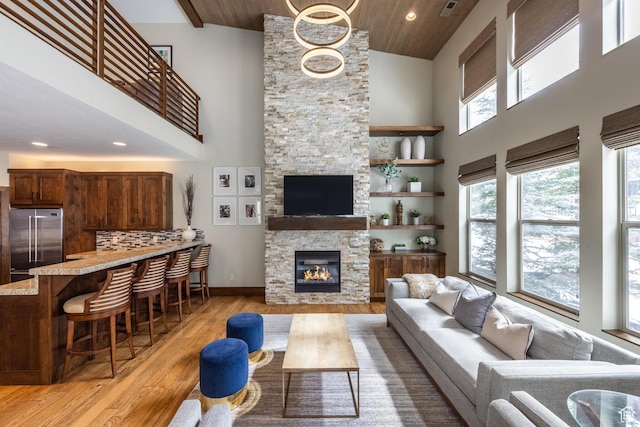 853 W Benjamin Pl, Kamas, UT 84036 - living room with recessed lighting, light wood-type flooring, a fireplace, visible vents, and high vaulted ceiling