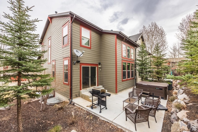 853 W Benjamin Pl, Kamas, UT 84036 - rear view of property with a patio area, entry steps, and a hot tub