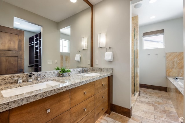 853 W Benjamin Pl, Kamas, UT 84036 - full bathroom featuring baseboards, stone tile floors, double vanity, and a sink