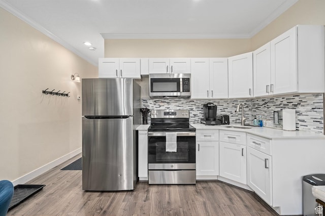 2285 Sidewinder Dr Unit 702, Park City, UT 84060 - kitchen featuring ornamental molding, light countertops, stainless steel appliances, and tasteful backsplash