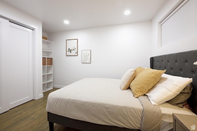 bedroom featuring wood finished floors, baseboards, and recessed lighting