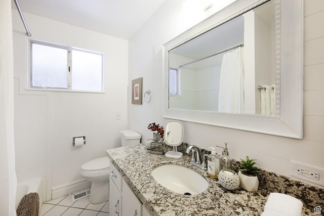 bathroom featuring visible vents, toilet, vanity, and tile patterned floors