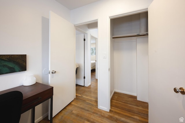 bedroom featuring a closet and wood finished floors
