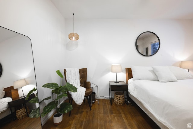 bedroom with hardwood / wood-style floors