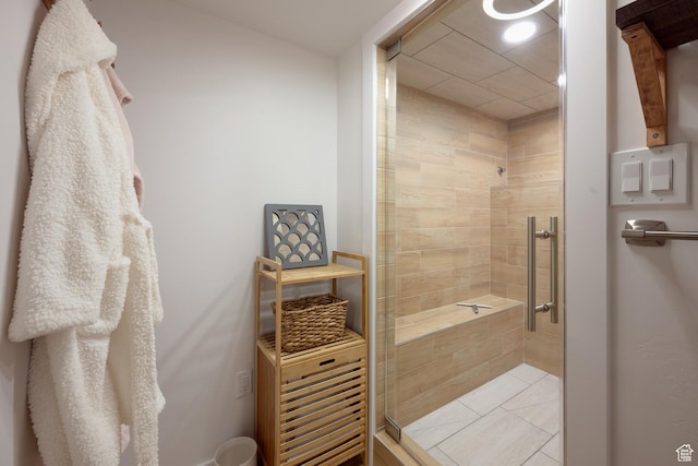 full bath featuring a shower stall and tile patterned floors