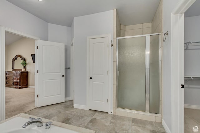1184 W Michaelsen, West Jordan, UT 84088 - bathroom featuring a walk in closet, a tub, and a stall shower