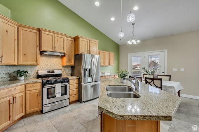 1184 W Michaelsen, West Jordan, UT 84088 - kitchen featuring a notable chandelier, a kitchen island with sink, stainless steel appliances, a sink, and light brown cabinetry