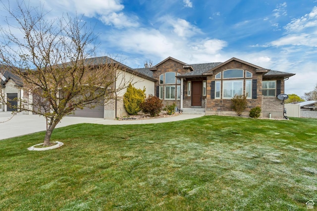 view of front of home with stone siding, a garage, concrete driveway, and a front yard