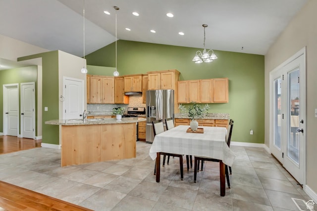 1184 W Michaelsen, West Jordan, UT 84088 - kitchen featuring light brown cabinets, a chandelier, backsplash, stainless steel appliances, and a sink