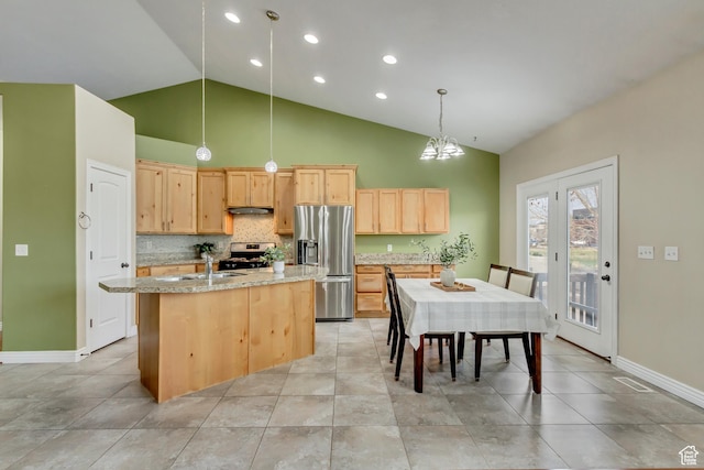 1184 W Michaelsen, West Jordan, UT 84088 - kitchen with backsplash, light stone countertops, a center island with sink, stainless steel appliances, and light brown cabinetry