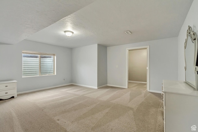 1184 W Michaelsen, West Jordan, UT 84088 - unfurnished bedroom featuring baseboards, light colored carpet, and a textured ceiling