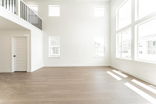 3759 W 950 N Unit 376, Lehi, UT 84043 - unfurnished living room with a high ceiling and light wood-style flooring