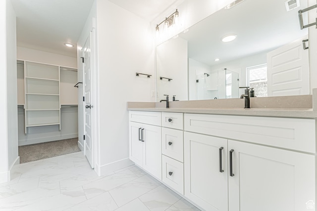 3759 W 950 N Unit 376, Lehi, UT 84043 - bathroom with a shower stall, double vanity, recessed lighting, a walk in closet, and marble look tiles