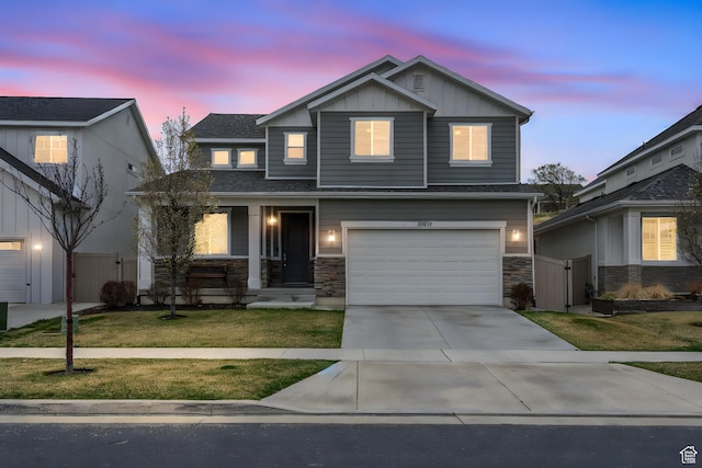 view of front facade featuring fence, board and batten siding, a gate, a front lawn, and a garage