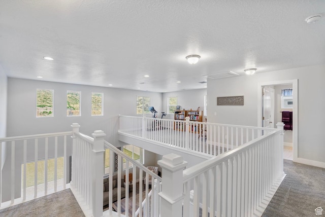 15097 S Cantle Dr, Bluffdale, UT 84065 - corridor with an upstairs landing, healthy amount of natural light, carpet, a textured ceiling, and recessed lighting