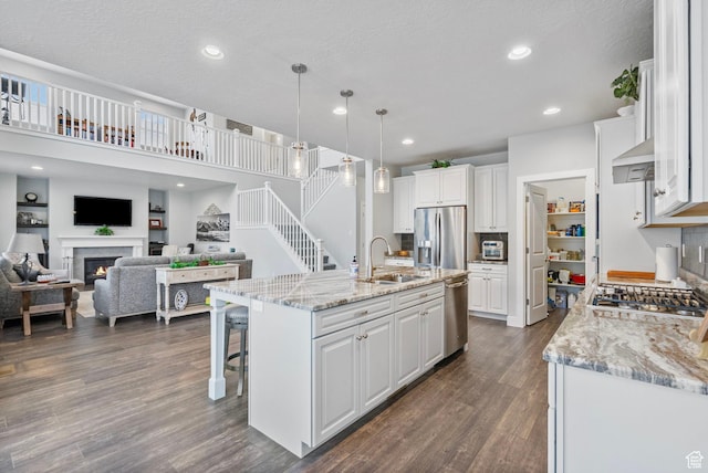 15097 S Cantle Dr, Bluffdale, UT 84065 - kitchen with a sink, stainless steel appliances, white cabinets, and recessed lighting
