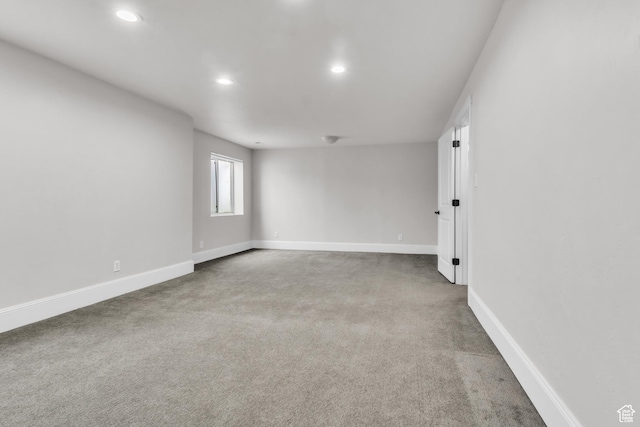 spare room with baseboards, carpet flooring, and recessed lighting