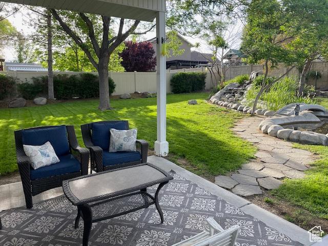 view of patio with outdoor lounge area and fence