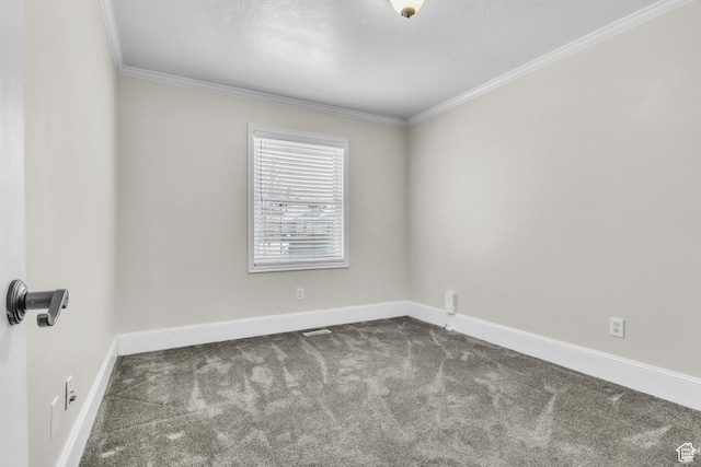 carpeted empty room with crown molding and baseboards