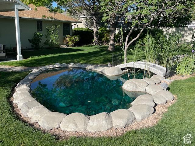 outdoor pool with a lawn