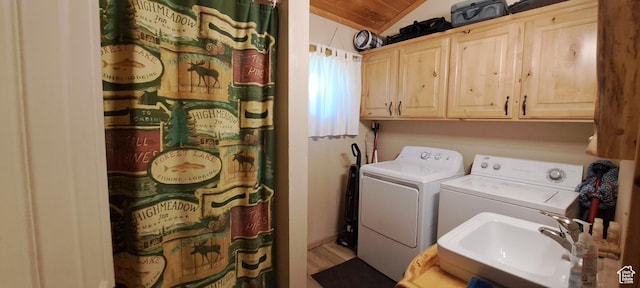 3526 Browning Rd, Island Park, ID 83429 - clothes washing area featuring a sink, cabinet space, independent washer and dryer, and wood finished floors