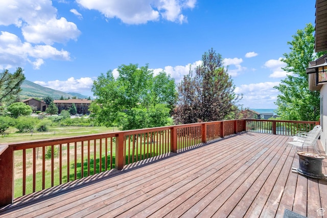 3674 N Willow Brooke Ln, Eden, UT 84310 - wooden deck with a mountain view and a yard