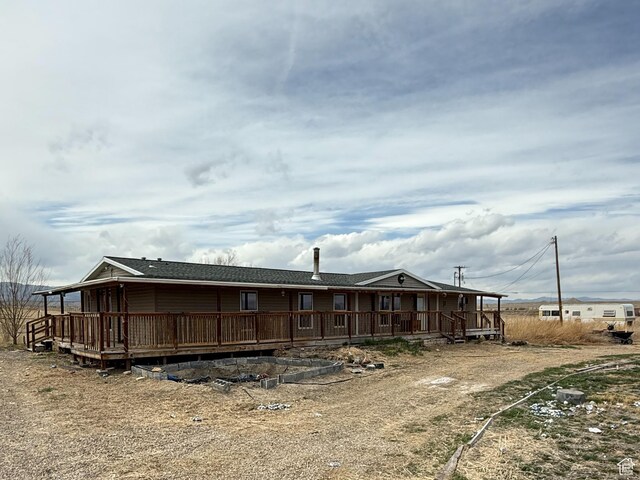 2445 N 260 W, Elmo, UT 84521 - rear view of property featuring a wooden deck