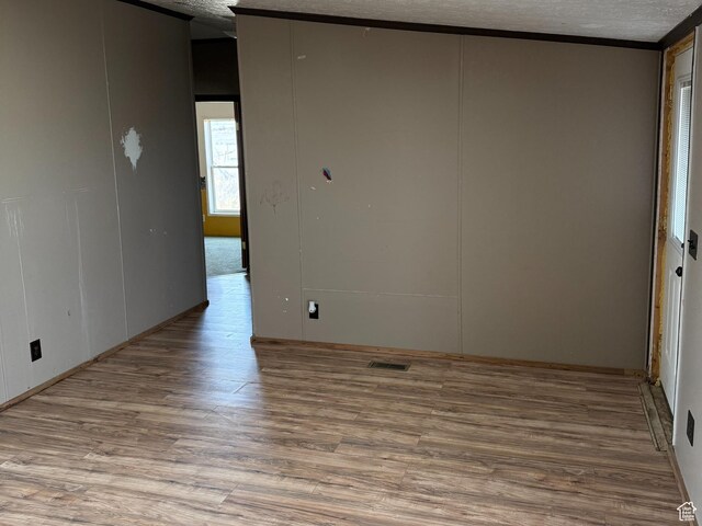 2445 N 260 W, Elmo, UT 84521 - empty room featuring visible vents, a textured ceiling, and wood finished floors
